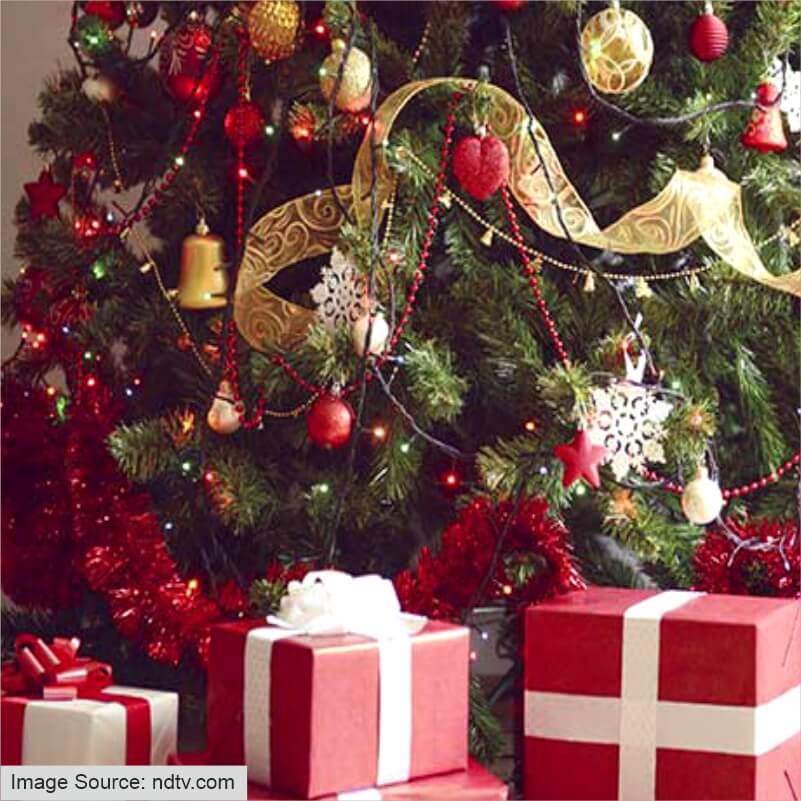 Presents underneath a festive Christmas tree.